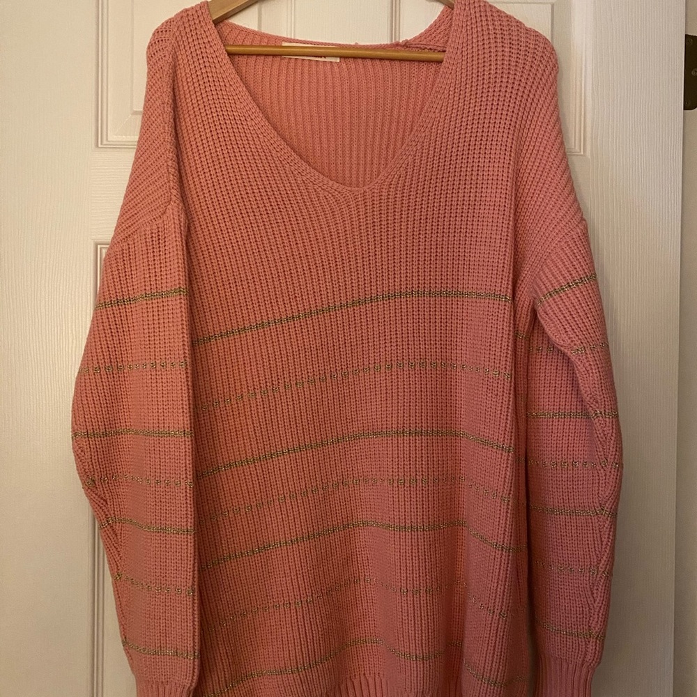 pink sweater with gold threaded accent